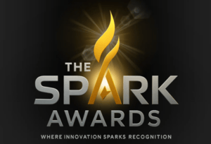 Realist Lab's Spark Awards logo on a black background